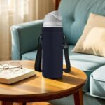 Pure black AUPET 1000ML neoprene water bottle sling holder with an adjustable shoulder strap and floral pattern.