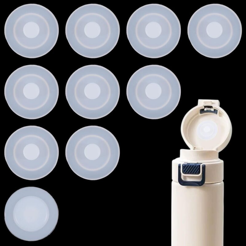 A close-up view of ten white, round silicone stopper plugs, neatly arranged, designed for water bottle lids.