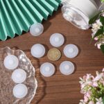 A close-up view of ten white, round silicone stopper plugs, neatly arranged, designed for water bottle lids.