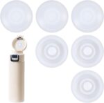 A close-up view of six round white silicone leak stoppers, neatly arranged, designed for water bottle and tumbler lids.