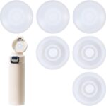 A close-up view of six round white silicone leak stoppers, neatly arranged, designed for water bottle and tumbler lids.