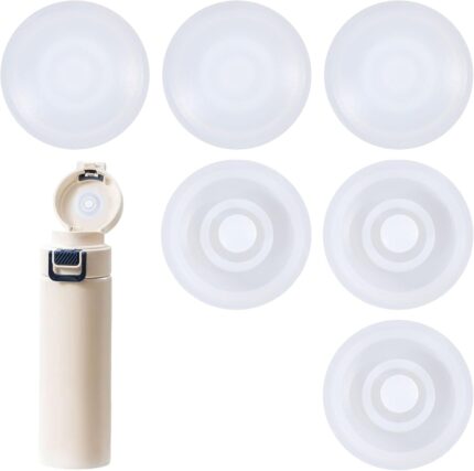 A close-up view of six round white silicone leak stoppers, neatly arranged, designed for water bottle and tumbler lids.