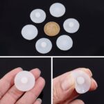 Close-up of a stack of 20 white, round silicone leak stoppers for water cups and bottles, showing their smooth texture.