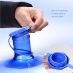 A pack of six white food-grade silicone water jug caps, designed for 3 and 5-gallon bottles with 55mm openings, shown against